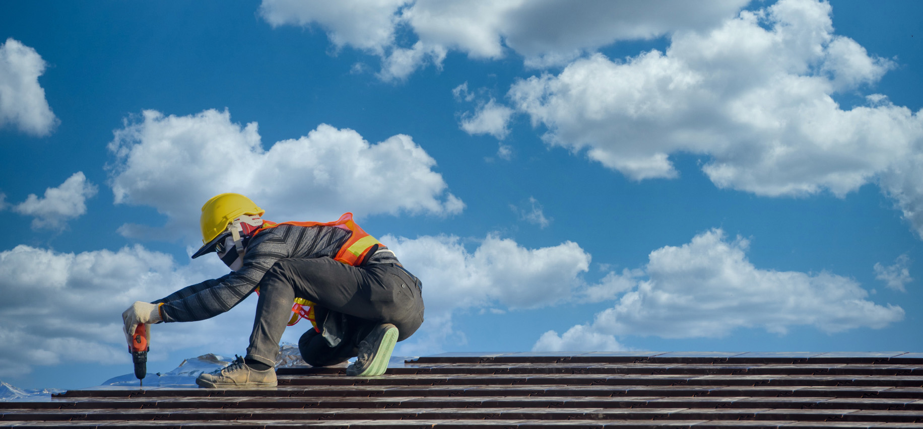 worker on a roof image